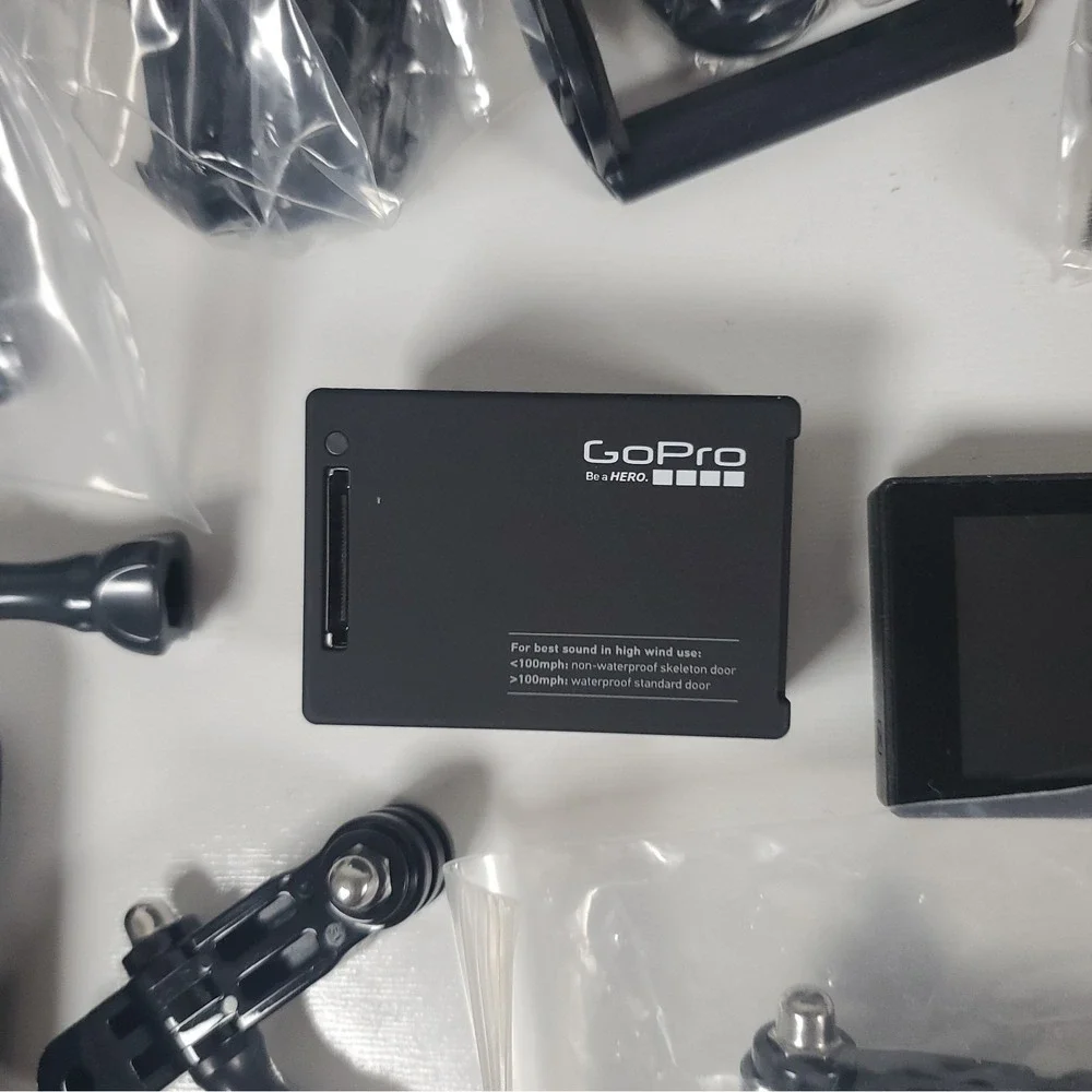 GoPro Hero4, Two Batteries, And Accessories Lot. Mounts, Body And Head Harness